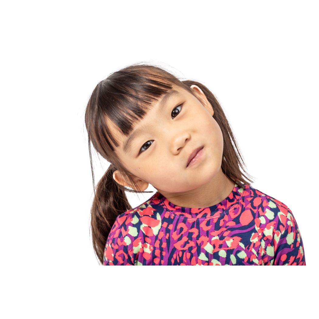 Close-up detail of girl wearing Wild Garden Kids Bamboo PJs in pink