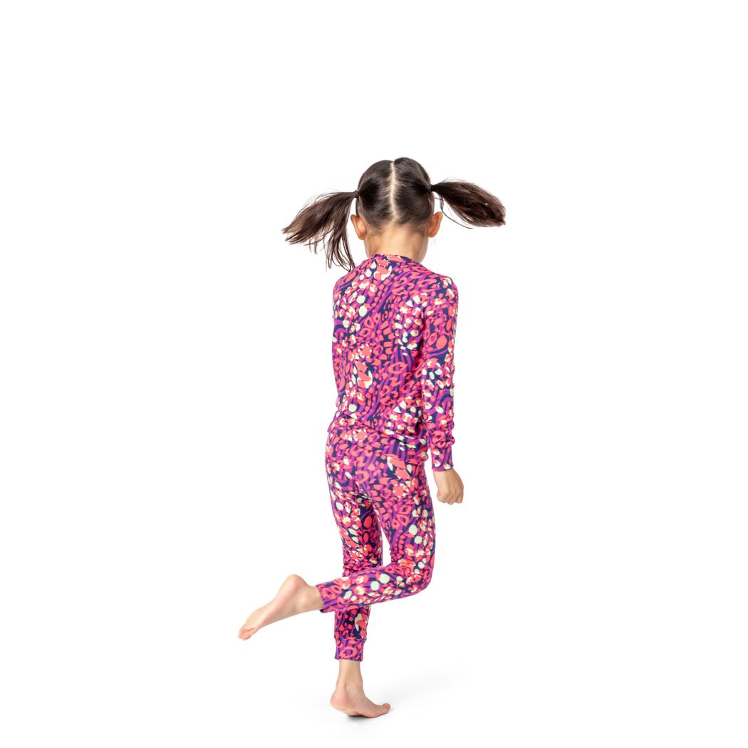 Girl wearing Wild Garden Kids Bamboo PJs in pink, side view
